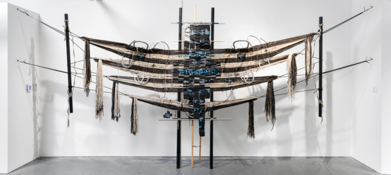 96 x 212 x 10 inches, Handspun and industrially spun wool, acrylic, cotton, metallic thread, novelty
yarn, rayon, wool rug mill ends, roving, polyurethane tape, coaxial cables, plastic tubing, nonmetallic conduit, stranded copper wire, digital-hand loomed jacquard fabric, wood and plastic loom bars and posts, nylon rope, zip ties