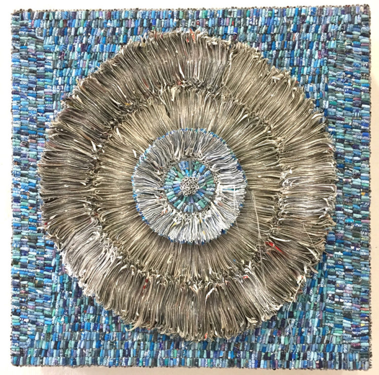 shredded non-profit and political solicitations, health care statements as well as magazine articles on cradled board, 10" x 10" x 3", 2018