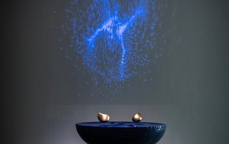 Nick Dong, Auspicious 88 - Two Golden Fishes of Connectivity, 2024. Metallic paint with drawing on high density foam with epoxy, acrylic mirror, fabric, steel, kinetic and audio components with micro computer. 33 x 33 x 42.5 in, 83.82 x 83.82 x 107.95 cm.